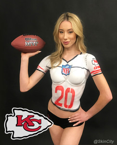 A model with a Kansas City chiefs football jersey body painted