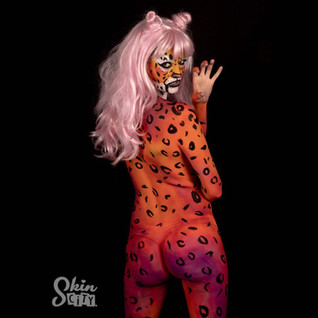 A model with leopard print body paint